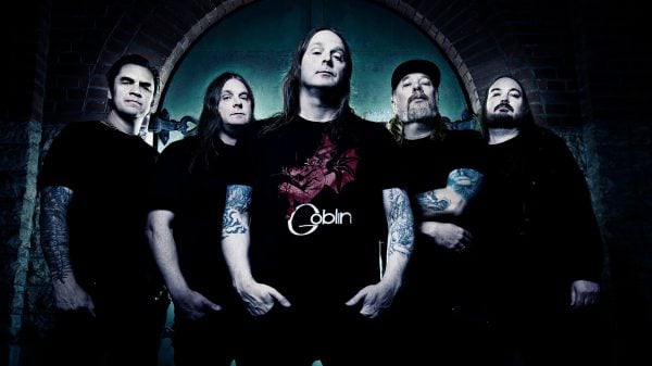 Members of At the Gates posed together in a staged, professional promotional photo.