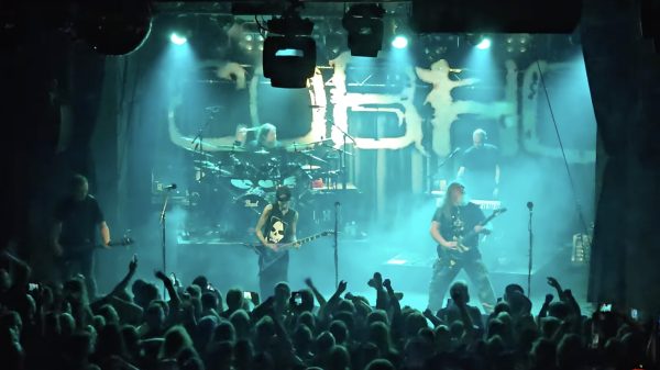 Members of Children Of Bodom performing at Tavastia in Helsinki during ‘A Celebration Of Music’ tribute concert, with crowd and green stage lighting