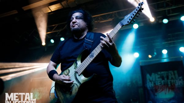 A photo of Dino Cazares playing with Fear Factory.